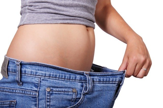 Loose pants and woman's belly