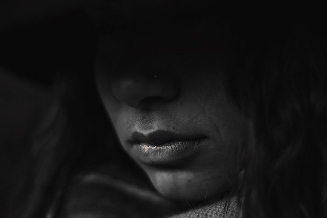 Dark shadow over person's face